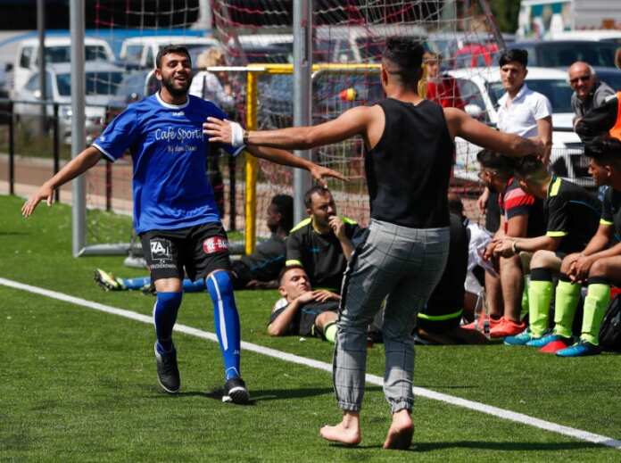 Asylum seekers take part in the soccer tournament