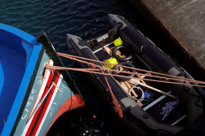 A dinghy of migrants is seen after arriving on a rescue boat at the port of Tarifa