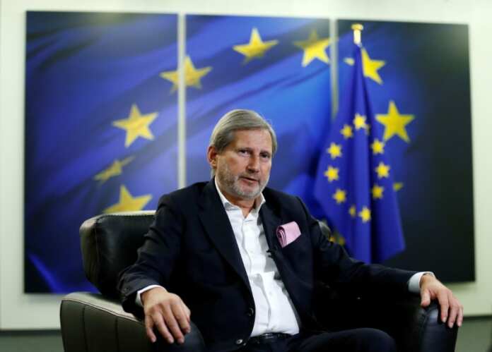 FILE PHOTO: EU Commissioner Johannes Hahn speaks during an interview with Reuters in Brussels