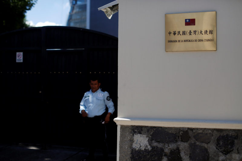 A security guard stands in front of the Taiwan embassy a day after the Salvadoran government announced that it has broken off diplomatic relations with Taiwan, in San Salvador