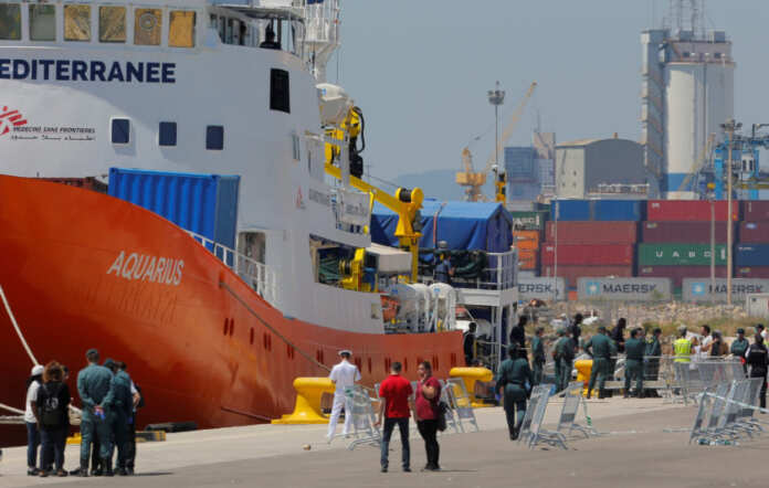FILE PHOTO: Refugees disembark the Aquarius rescue ship in the port in Valencia
