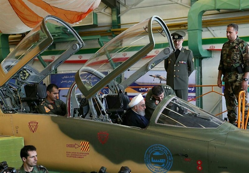 Iranian President Hassan Rouhani is seen in a newly unveiled fighter jet in Tehran