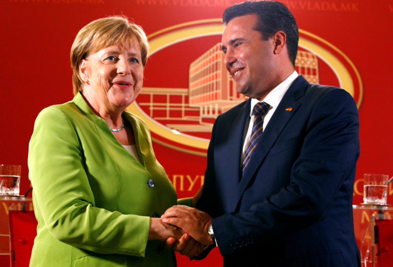 Macedonian Prime Minister Zoran Zaev and German Chancellor Angela Merkel shake hands after a news conference in Skopje
