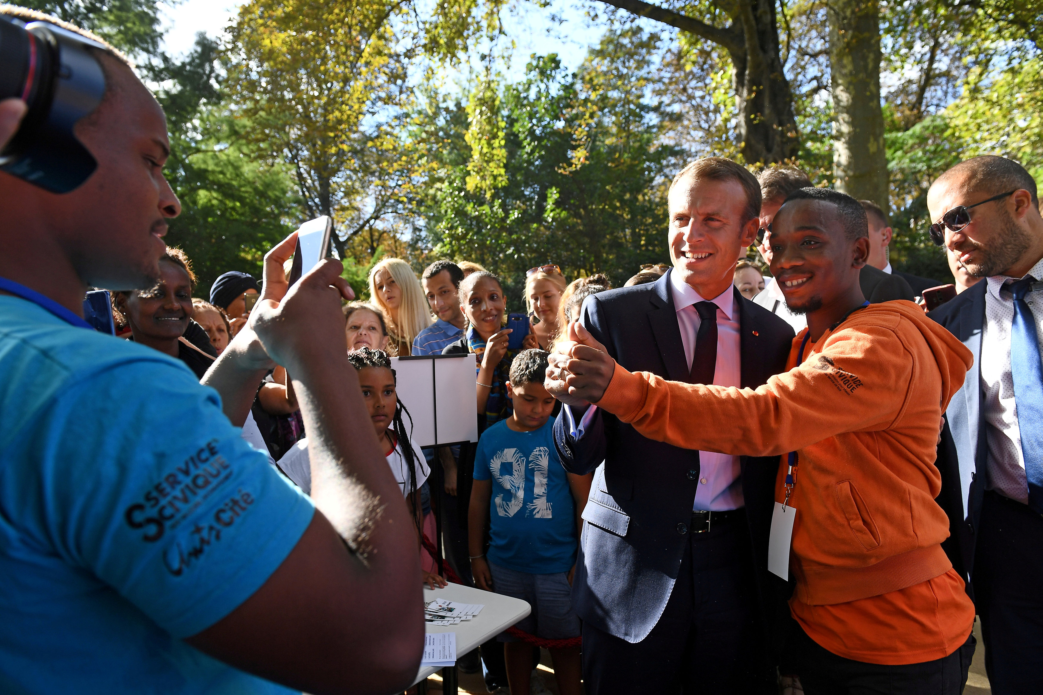 FILE PHOTO: French President Emmanuel Macron poses for a selfie as visitors are allowed access to the Elysee Palace in Paris