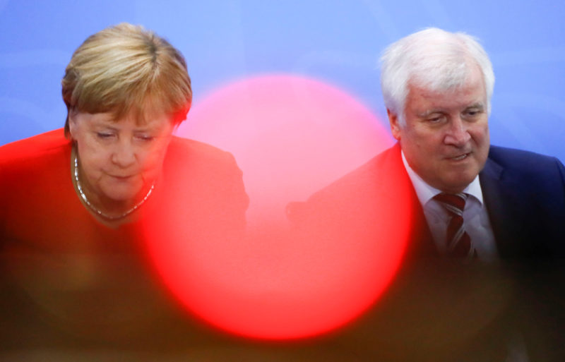 FILE PHOTO: German Chancellor Angela Merkel and Interior Minister Horst Seehofer leave a news conference following the so called a housing summit on rising rents in many German cities and a general shortage of affordable housing in Berlin