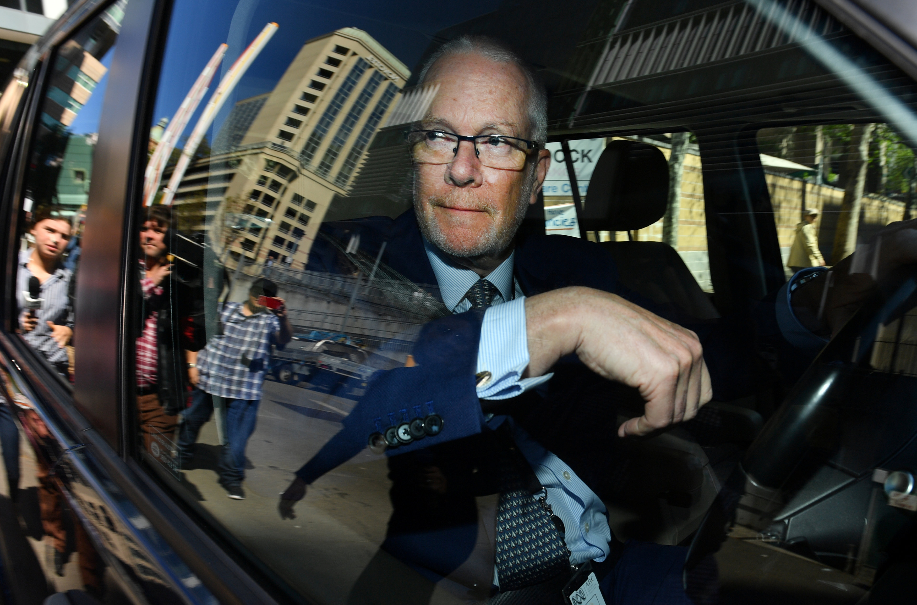 Former ABC chairman Justin Milne leaves the ABC studios after resigning his chairmanship, in Sydney