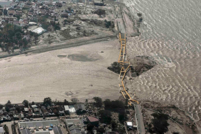 Aerial view of bridge damaged by an earthquake and tsunami in Palu, Central Sulawesi