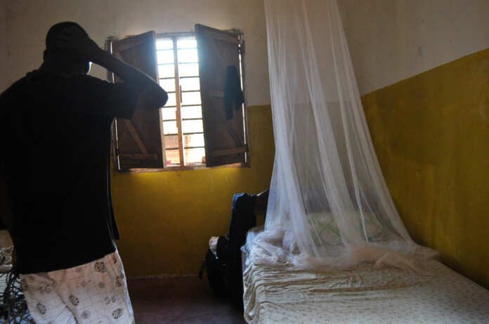 A resident stands inside the room, where Italian volunteer for the Italian charity Africa Milele lived before she was seized, in Chakama trading centre of Magarini, Kilifi County