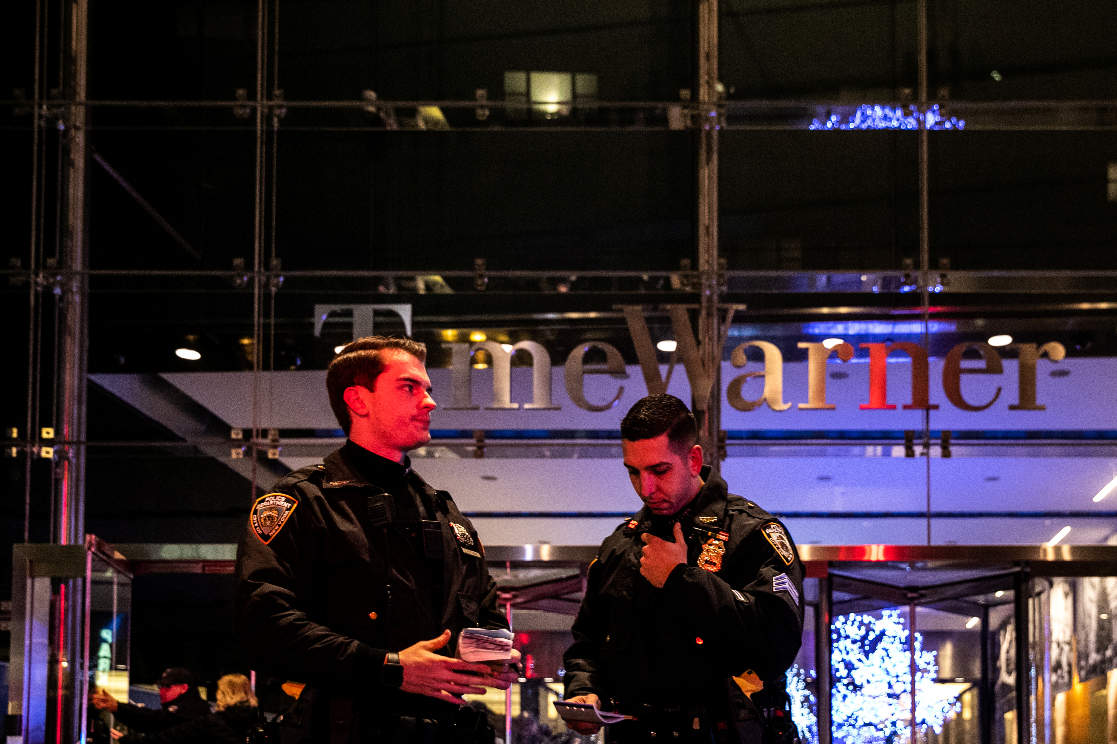 NYPD officers stand near the Time Warner Center Building after the building was evacuated due to a bomb threat, in the Manhattan borough of New York City