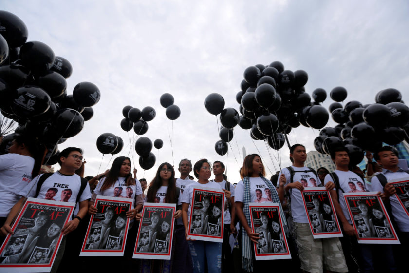 FILE PHOTO: Activists call for release of imprisoned Reuters journalists Wa Lone and Kyaw Soe Oo in Yangon