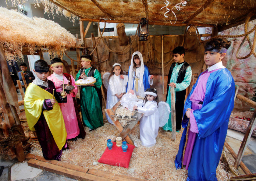 Children participate in a nativity scene at Mart Shmoni Church in the town of Bashiqa, east of Mosul