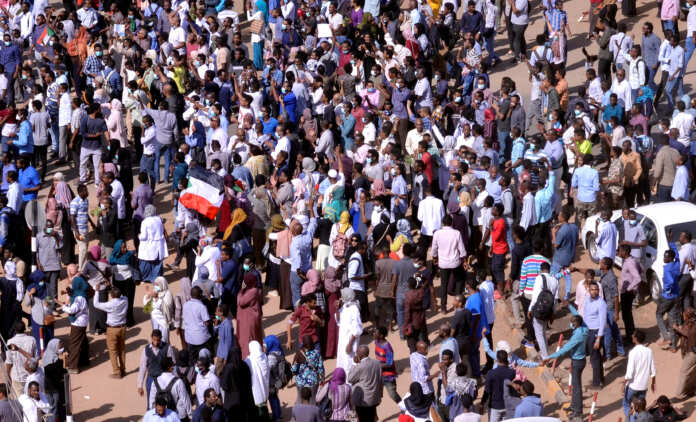 FILE PHOTO: Sudanese demonstrators chant slogans as they march along the street during anti-government protests in Khartoum