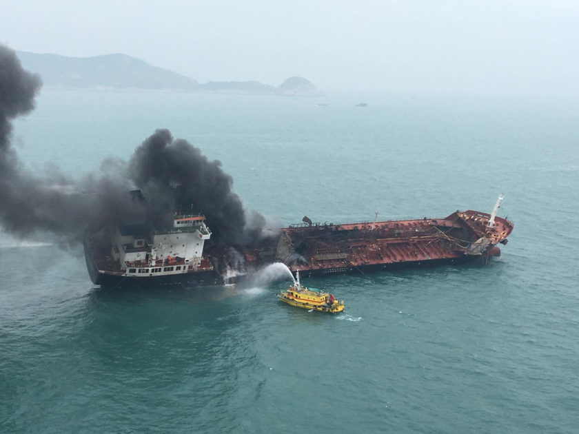 An oil tanker on fire is seen near Lamma island, Hong Kong