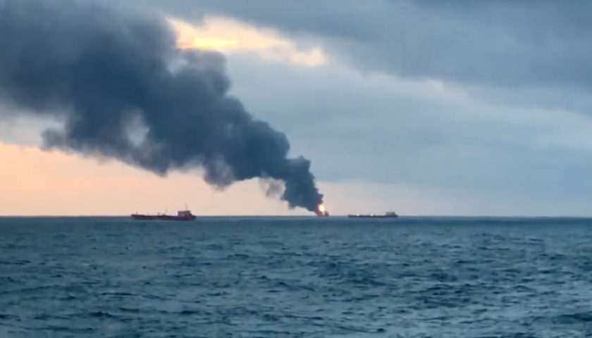 Smoke rises from a fire at a ship in the Kerch Strait near Crimea