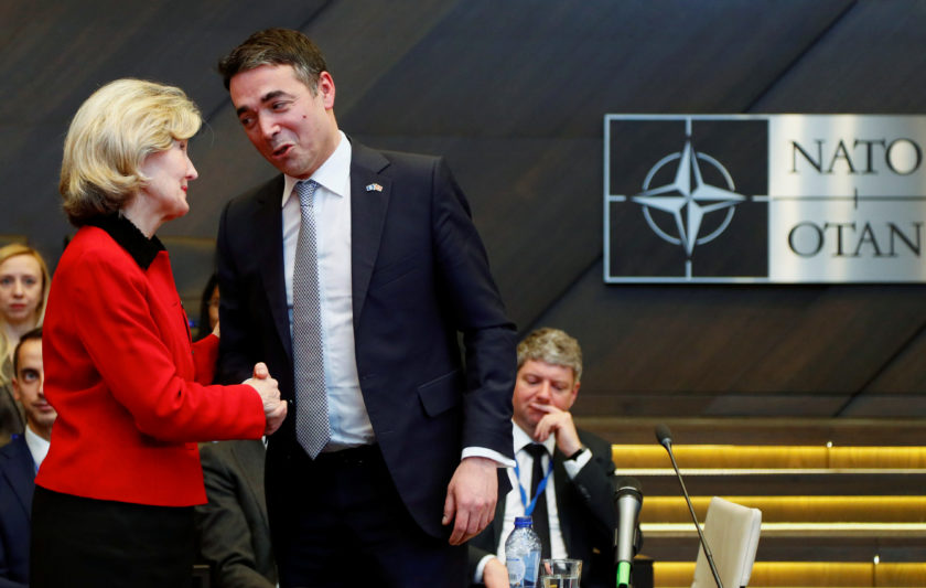 U.S. Ambassador to NATO Bailey Hutchison shakes hands with Macedonian FM Dimitrov during a signature ceremony of the accession protocol between the Republic of North Macedonia and NATO in Brussels