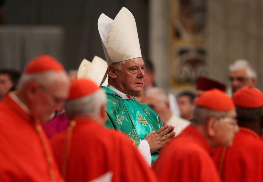 FILE PHOTO: Newly elected cardinal Gerhard Ludwig Muller of Germany arrives during a consistory ceremony led by Pope Francis in Saint Peter's Basilica at the Vatican