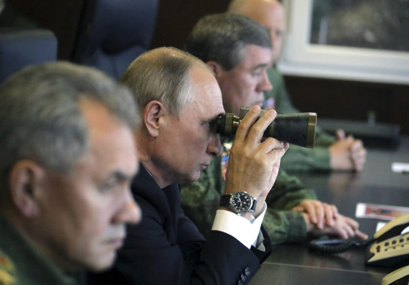 FILE PHOTO: Russian President Putin watches the Zapad-2017 war games at a military training ground in the Leningrad region