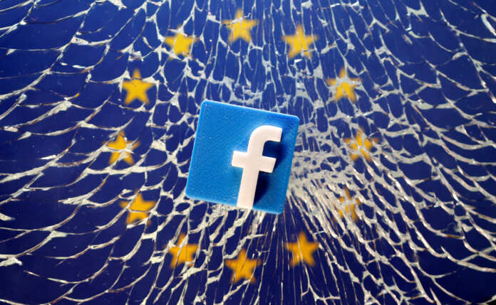 A 3D printed Facebook logo is placed on broken glass above a printed EU flag in this illustration