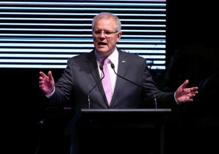 FILE PHOTO: Australia's Prime Minister Scott Morrison speaks during the INPEX Gala Dinner in Darwin