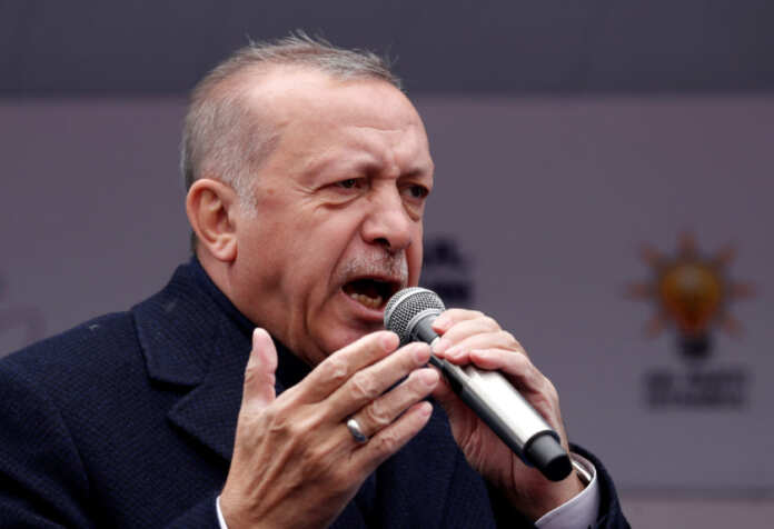 Turkish President Erdogan addresses his supporters during a rally for the upcoming local elections in Istanbul
