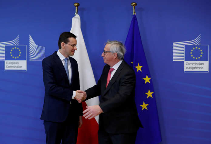 Poland's Prime Minister Morawiecki is welcomed by European Commission President Juncker in Brussels