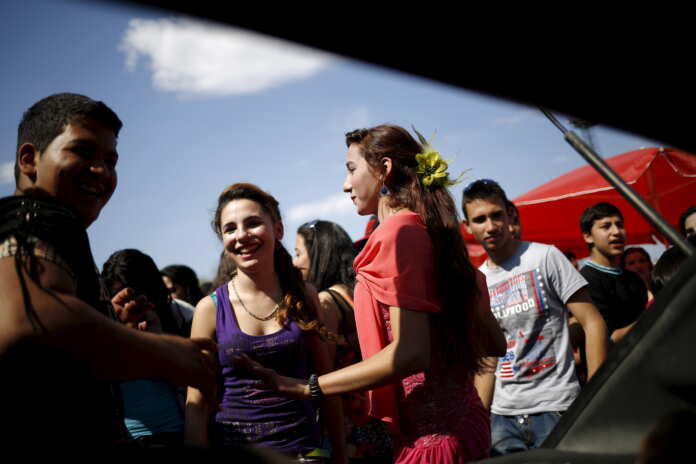 Bulgarian Roma people from the close-knit Kalaidjii clan dance during a so-called