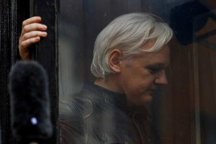 FILE PHOTO: WikiLeaks founder Julian Assange is seen on the balcony of the Ecuadorian Embassy in London