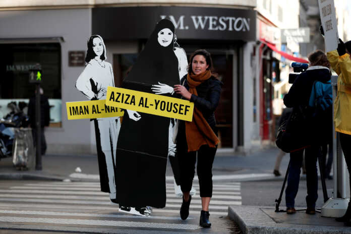 FILE PHOTO: Demonstrators from Amnesty International protest outside the Saudi Arabian Embassy on International Women's day in Paris