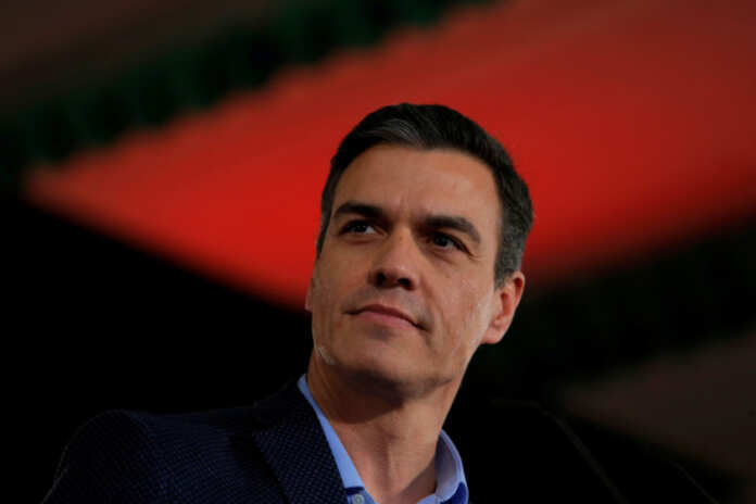 FILE PHOTO: Spain's Socialist leader and current PM Pedro Sanchez looks on as he delivers his speech during a PSOE party meeting before he kicks off his political campaign ahead of the April 28 general election in Dos Hermanas