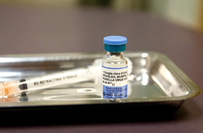FILE PHOTO: A vial of the measles, mumps, and rubella (MMR) vaccine is pictured at the International Community Health Services clinic in Seattle