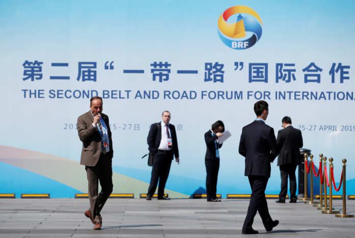 Delegates rest outside the China National Convention Center, the venue for the Belt and Road Forum, in Beijing