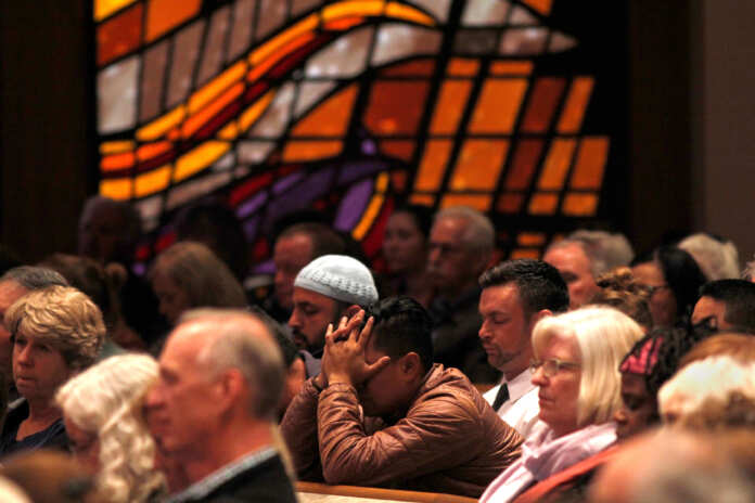 A candlelight vigil is held at Rancho Bernardo Community Presbyterian Church for victims of a shooting incident at the Congregation Chabad synagogue in Poway