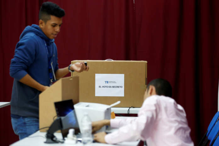 Technicians install a digital polling station during the preparations for the upcoming general election in Panama City