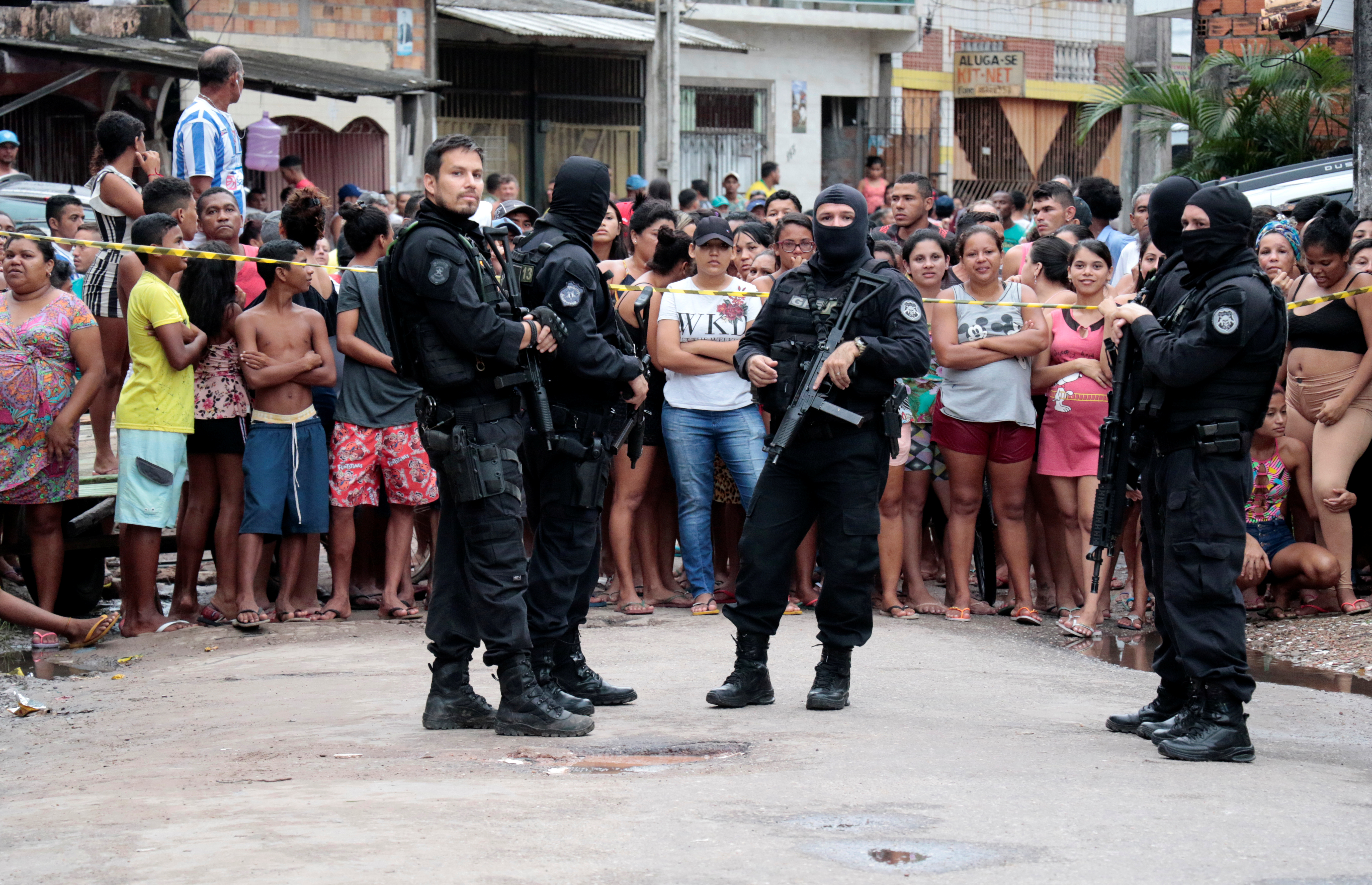 Policemen are seen at a site where, according to local media, an armed group entered and opened fire at a bar, killing and wounding its patrons, in Belem