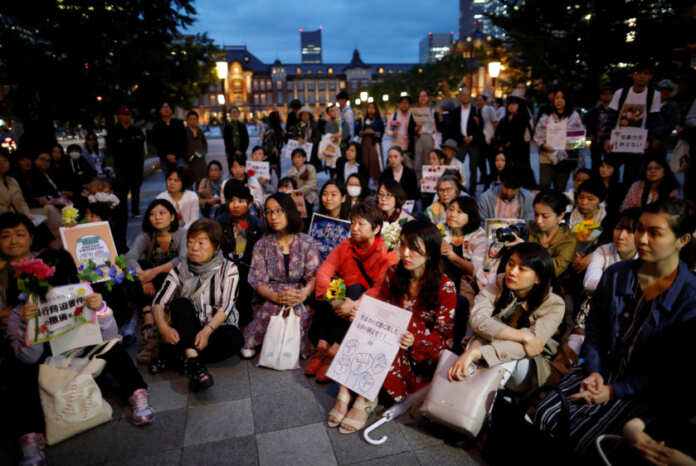 Protesters gather at the rally called 'Flower Demo' to criticize recent acquittals in court cases of alleged rape in Japan and call for revision of the anti-sex crime law, in Tokyo
