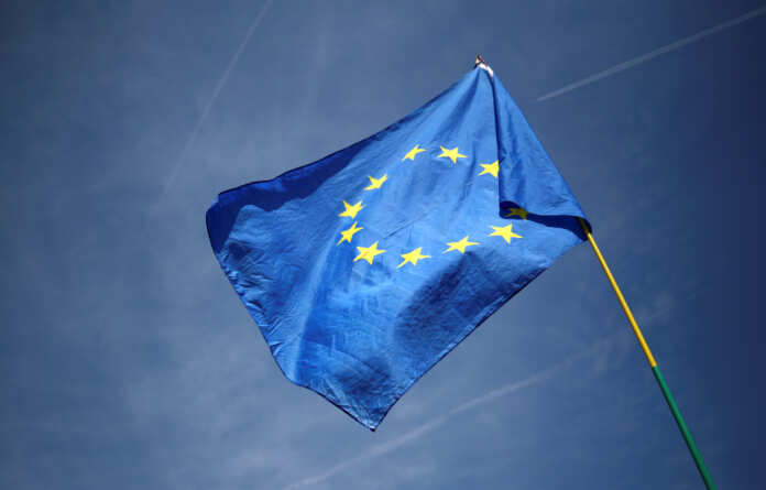 An EU flag flutters outside the Houses of Parliament in London
