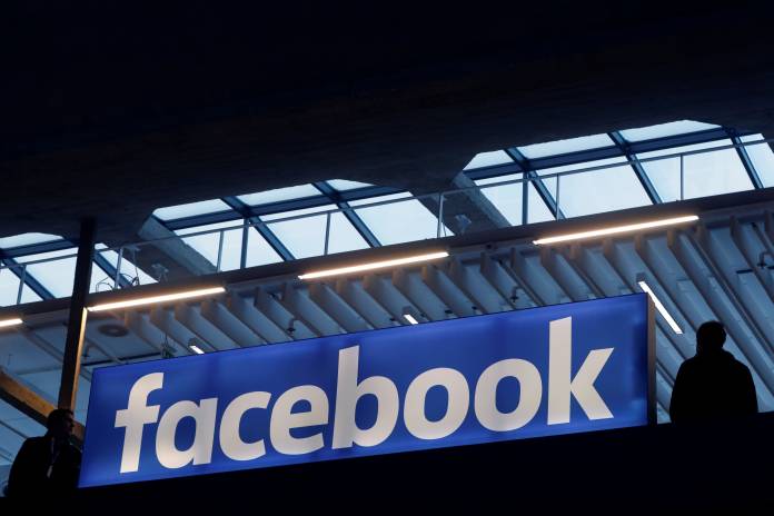 Facebook logo is seen at a start-up companies gathering at Paris' Station F in Paris