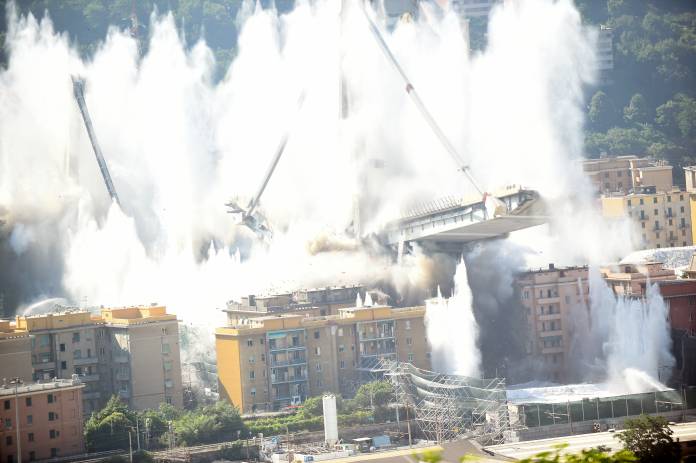 Controlled explosions demolish two of the pylons of the Morandi bridge almost one year since a section of the viaduct collapsed killing 43 people, in Genoa