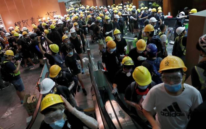 Protesters break into the Legislative Council building during the anniversary of Hong Kong's handover to China in Hong Kong