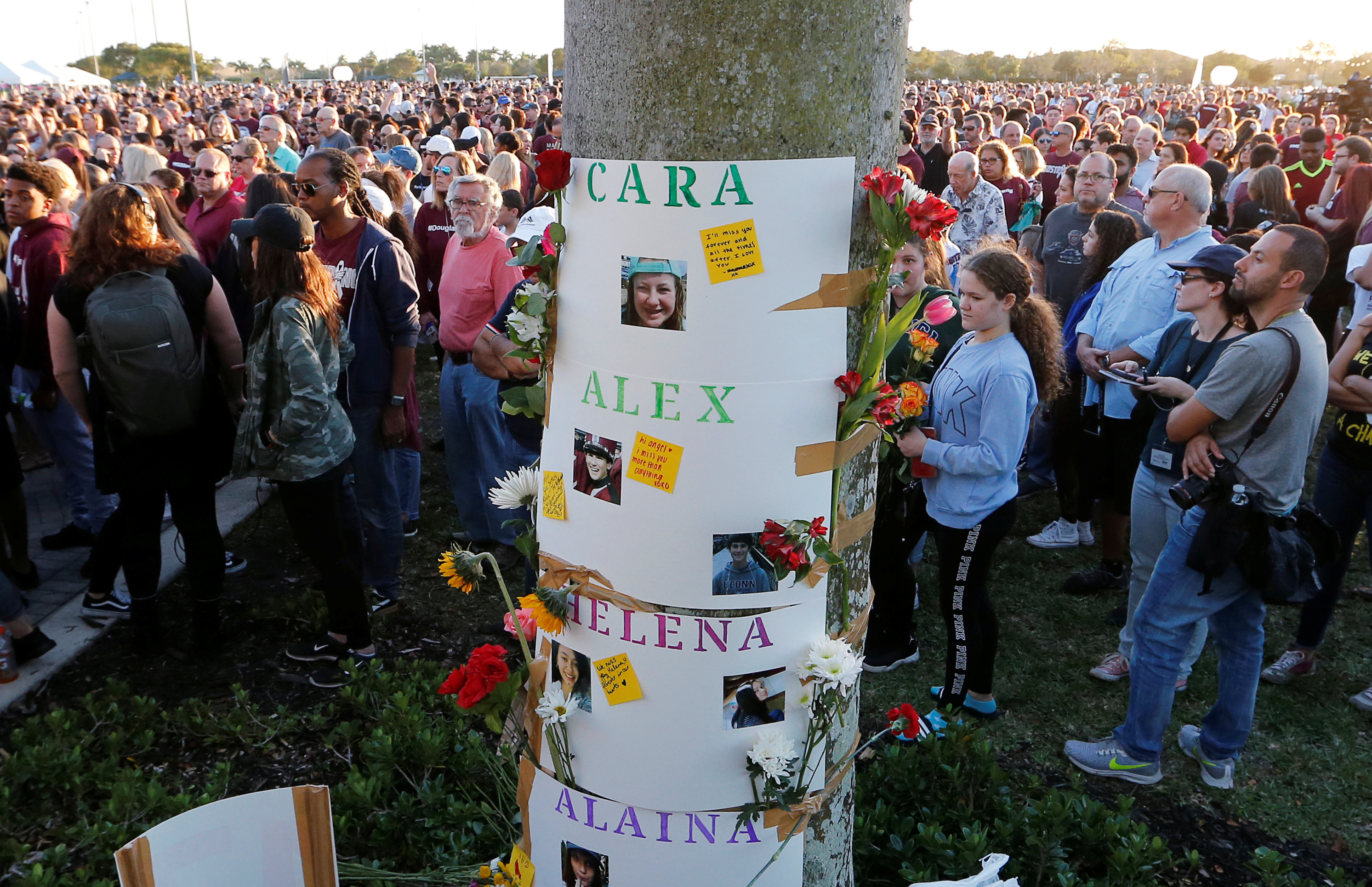 Posters with the names of victims are shown during a memorial service on the one--year anniversary of the shooting which claimed 17 lives at Marjory Stoneman Douglas High School in Parkland