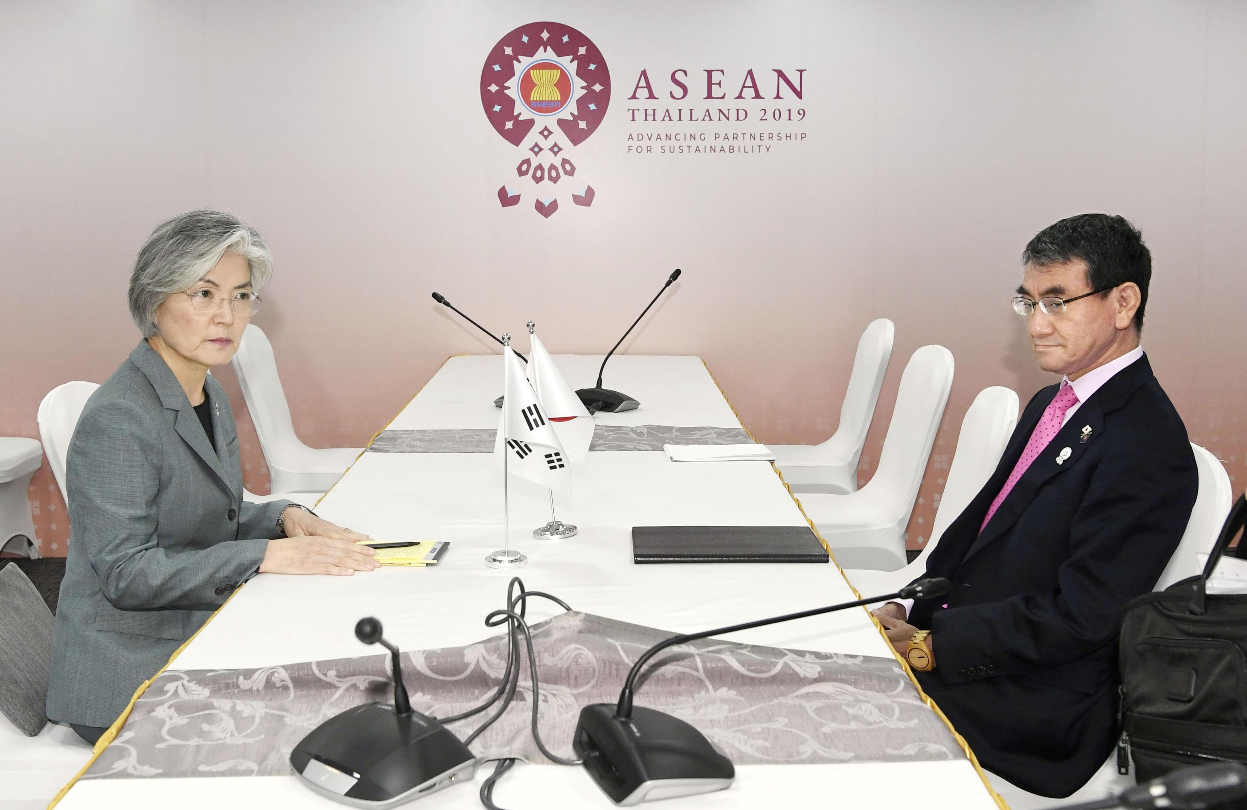 FILE PHOTO: South Korean Foreign Minister Kang Kyung-wha meets her Japanese counterpart Taro Kono during the ASEAN Foreign Ministers' Meeting in Bangkok