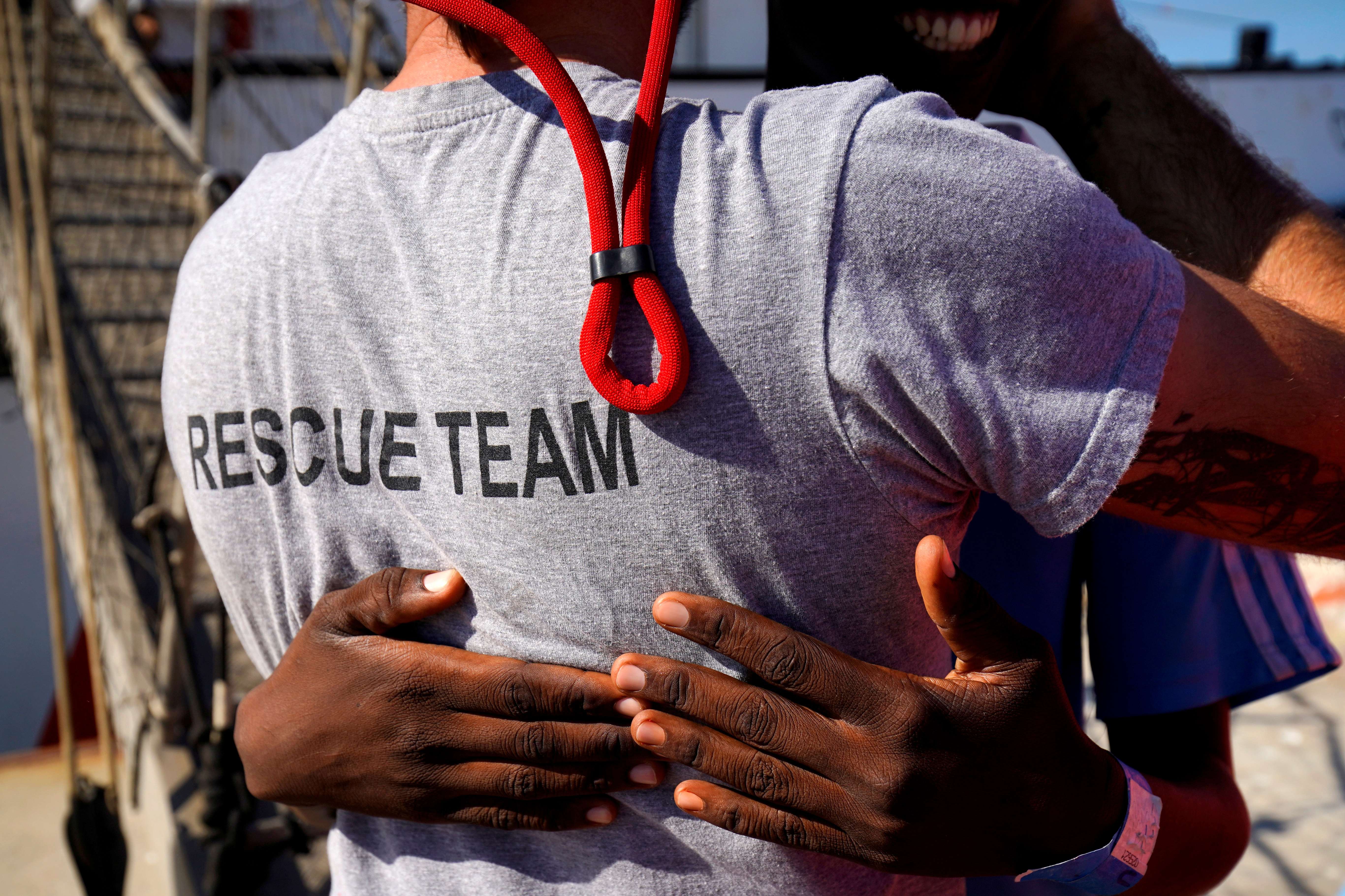 FILE PHOTO: A migrant rescued by NGO Proactiva Open Arms rescue boat in central Mediterranean Sea embraces Open Arms Head Mission, Riccardo Gatti, after arriving at the port of Algeciras in San Roque