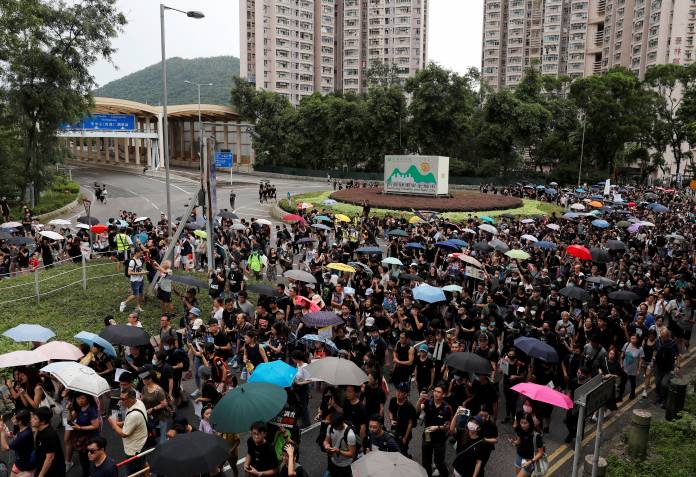 Anti-extradition bill protesters march at Tseung Kwan O residential district in Hong Kong