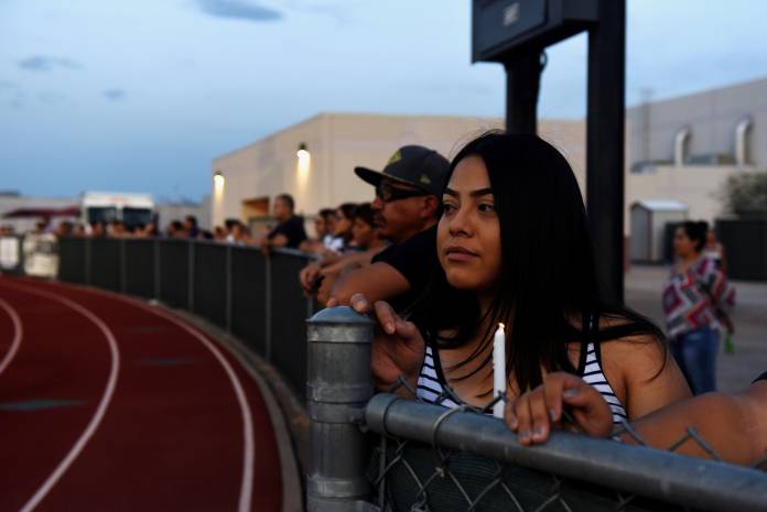 People pay their respects two days after a mass shooting in El Paso