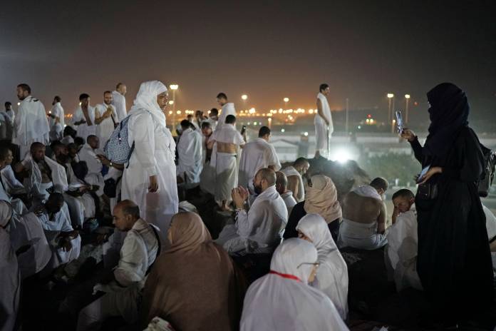 Muslim pilgrims gather on Mount Mercy on the plains of Arafat during the annual haj pilgrimage