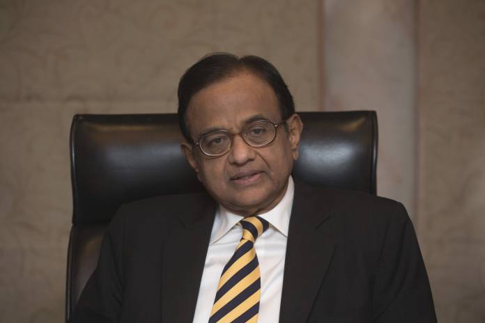 India's Finance Minister Chidambaram attends a news conference in Hong Kong
