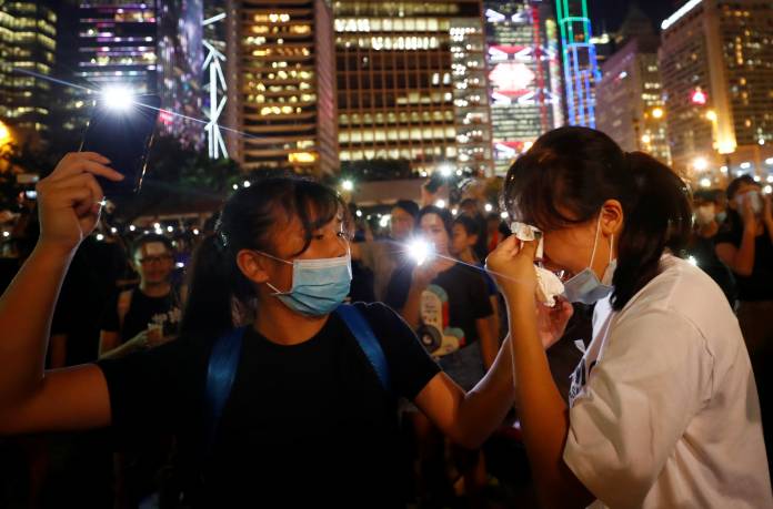 Students stage a rally to call for political reforms outside City Hall in Hong Kong