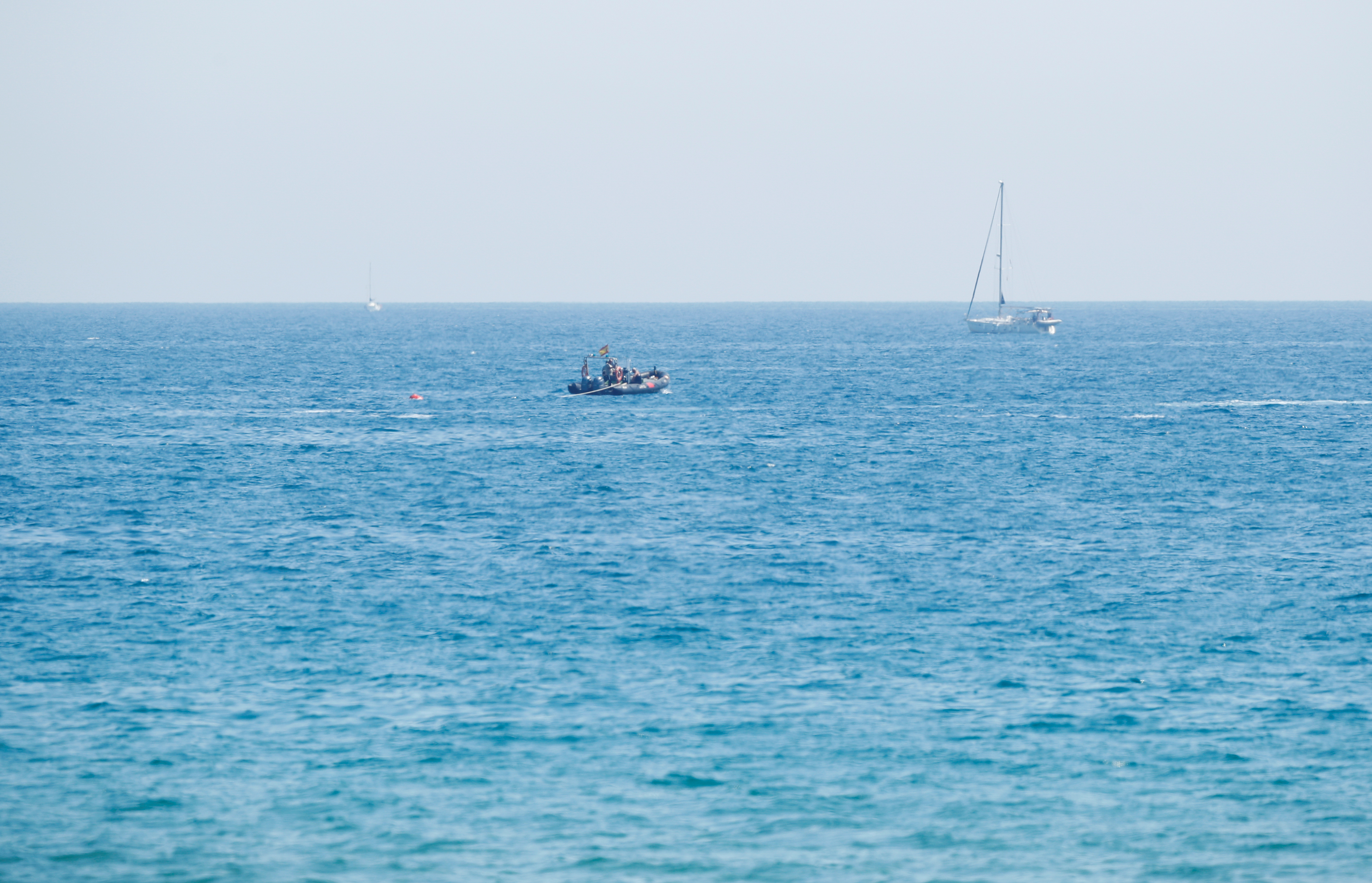Members of the Spanish army work at the site where an explosive device was found, possibly from the Spanish Civil War, at Sant Sebastia beach in Barcelona