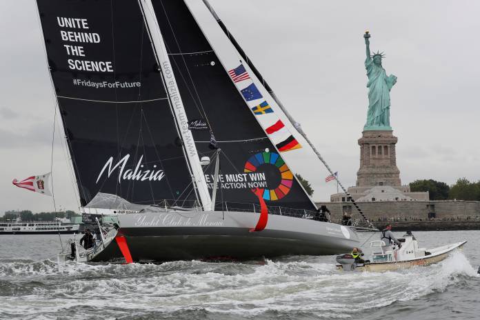 Swedish 16-year-old activist Greta Thunberg sails past the Statue of Liberty on the Malizia II racing yacht in New York Harbor
