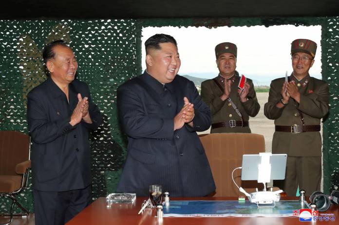 FILE PHOTO: KCNA picture of North Korean leader Kim Jong Un attending the test of a multiple rocket launcher
